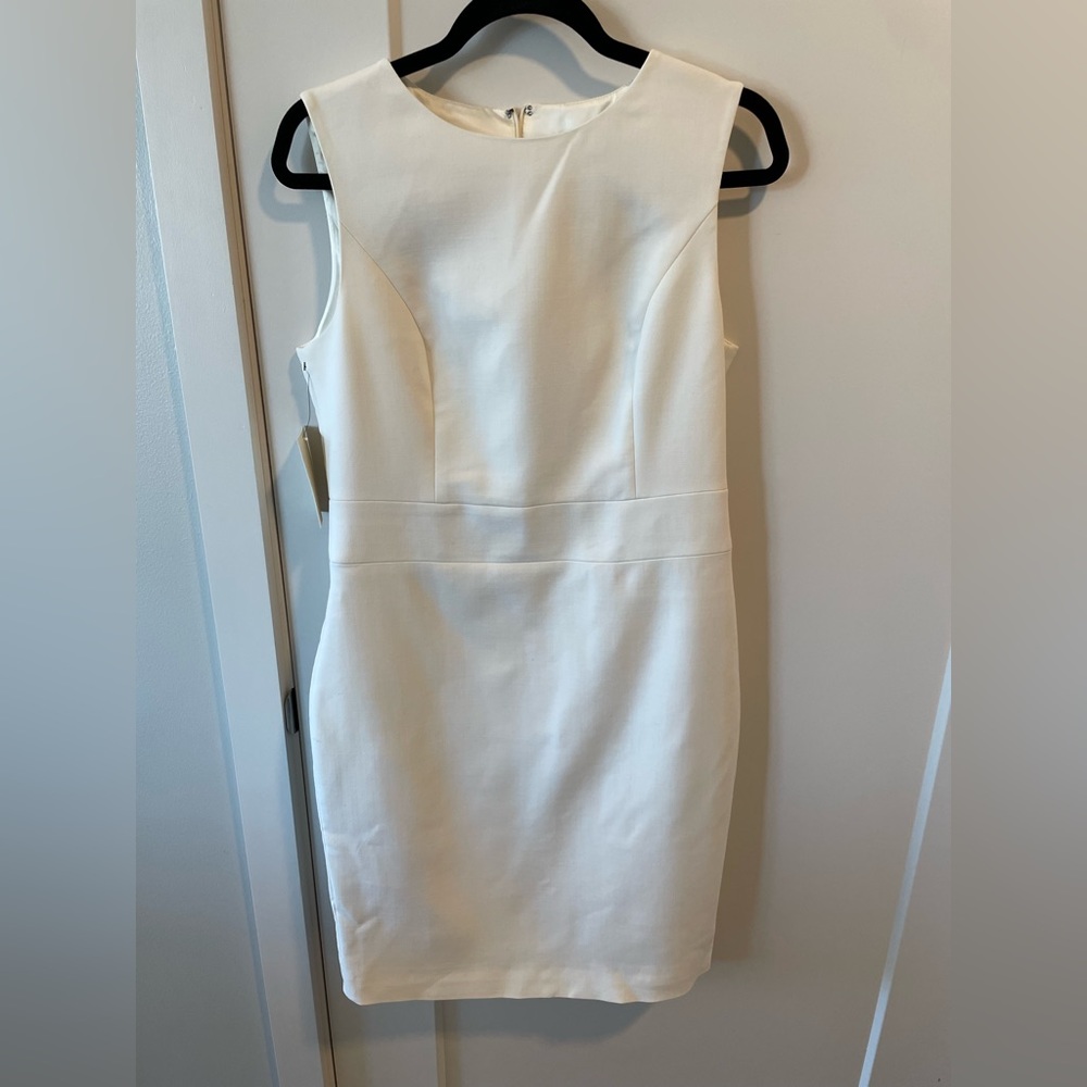 Suit studio of white fitted dress